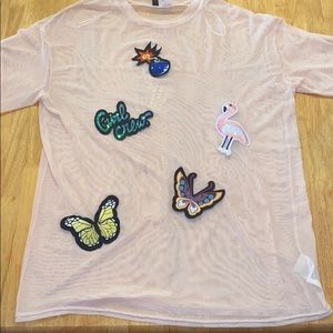 A very pink , sheer blouse for teens